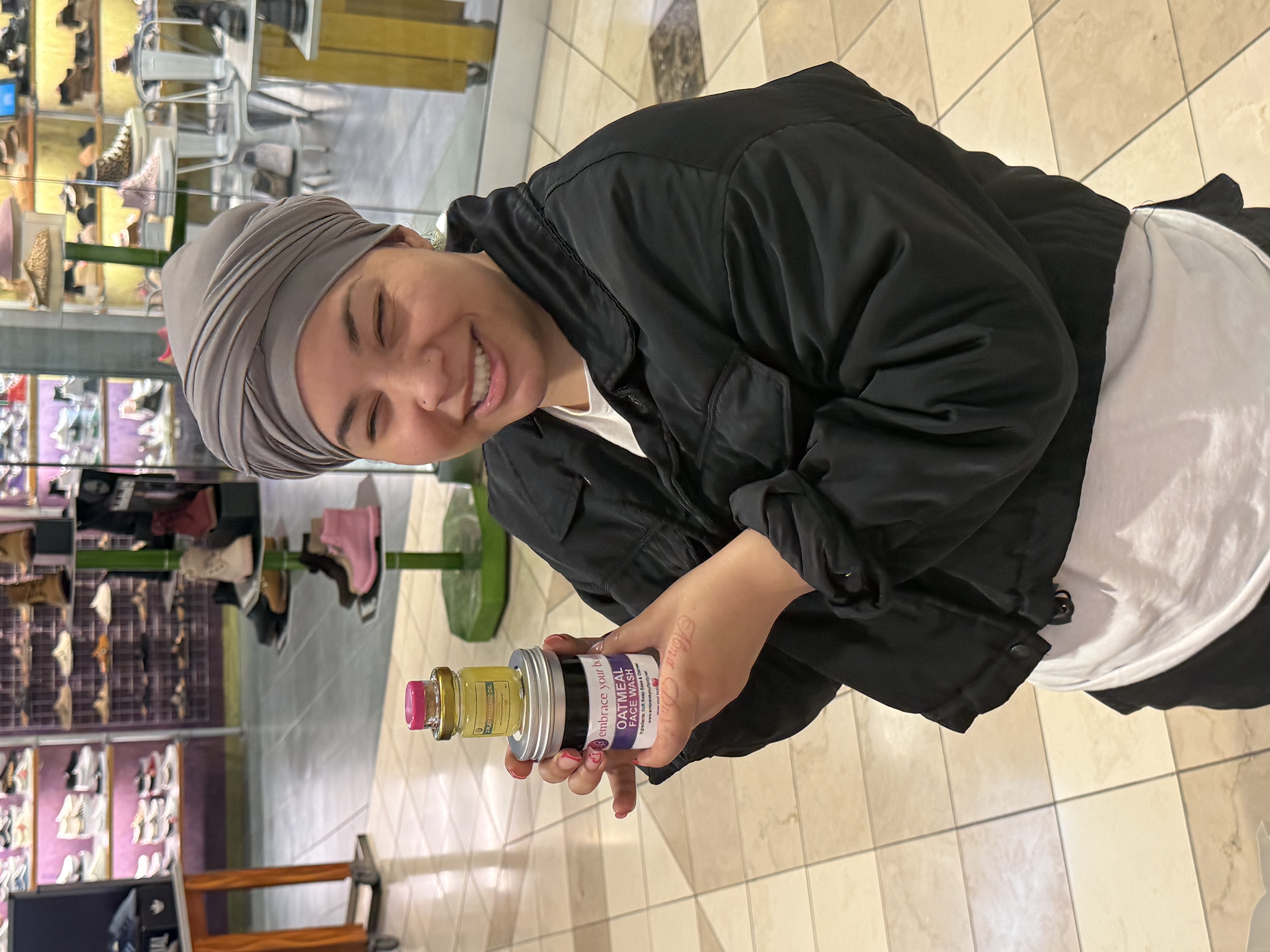 Customer holding the Oatmeal Face Wash and 2Play Massage Oil products.